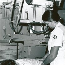 Agnes Fee, Radiology Technologist with young patient on the SS HOPE.